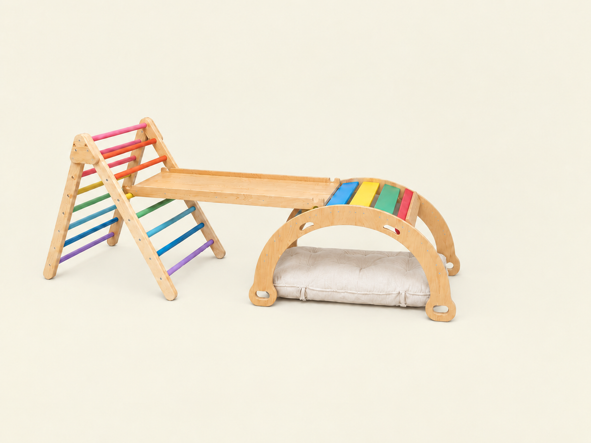 3 in 1 set containing pikler,  Flat bar rocker, ramp and optional cushion in rainbow theme