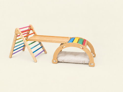 3 in 1 set containing pikler,  Flat bar rocker, ramp and optional cushion in rainbow theme