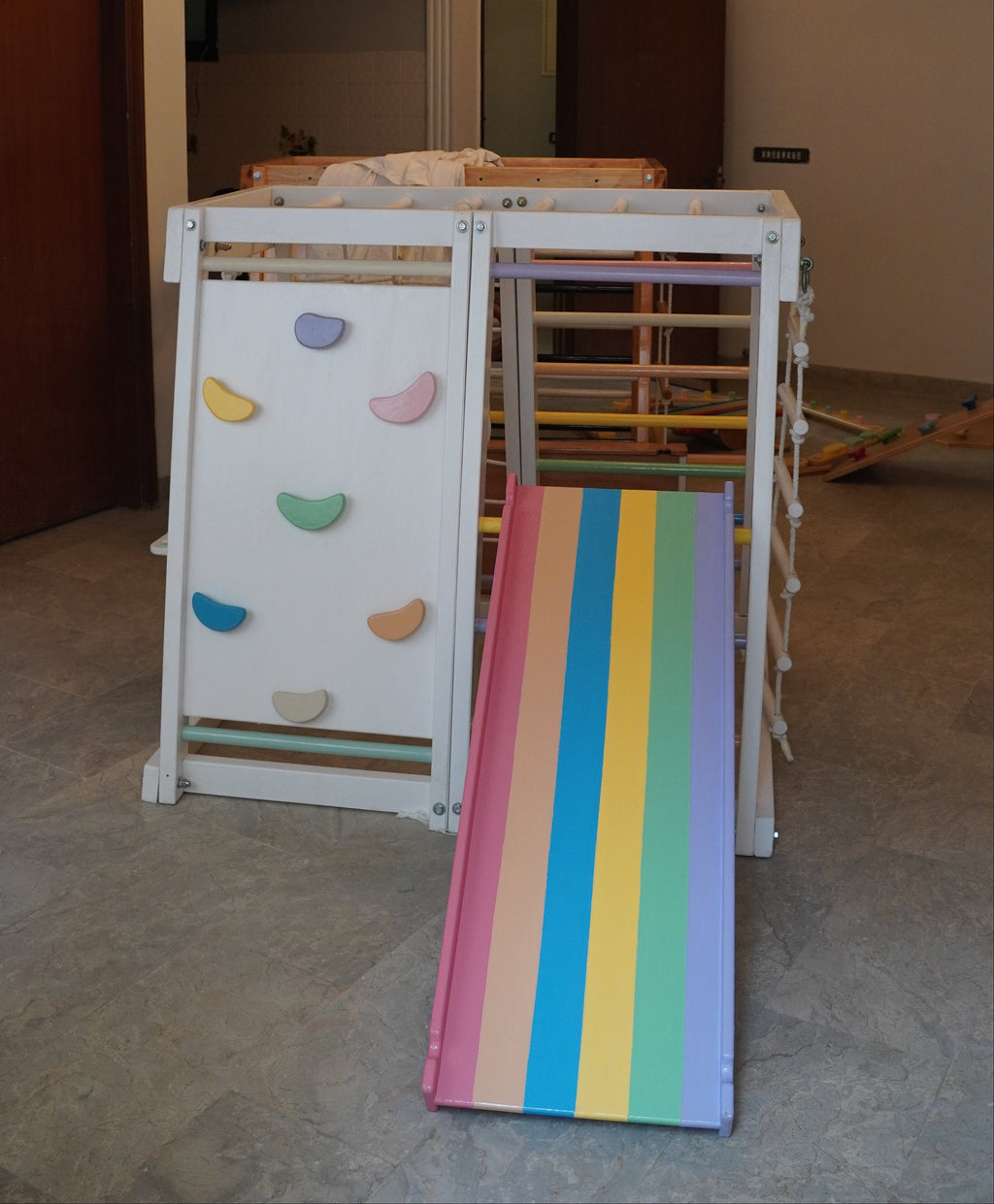 Wooden White and rainbow themed Indoor Jungle Gym - 4 Feet with ramp, rope ladder, ladder, swing, rock climbing wall, mesh and ramp.