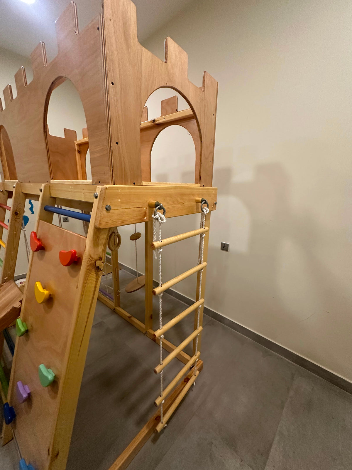 Castle Park with climbing wall, ladder, swing, mesh, rope ladder, ramp and gymnastic rings.