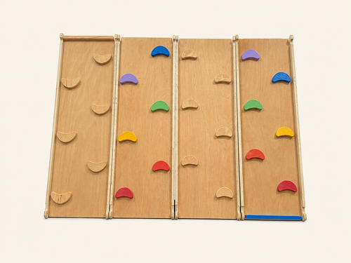  2-in-1 slide and wooden climbing wall with curved w-inooden handholds ramps.